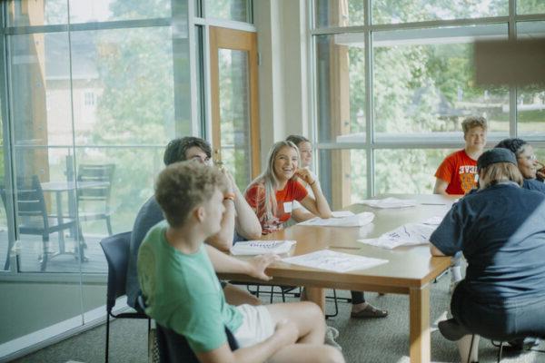 a group of people sitting at a table